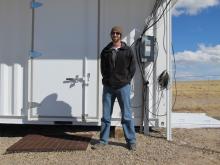 Our tour guide and LWA Project Engineer, Joe Craig in front of the LWA equipment enclosure